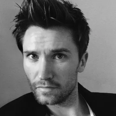 Black and white headshot of Sam Jones, owner of Three Parks Creative.